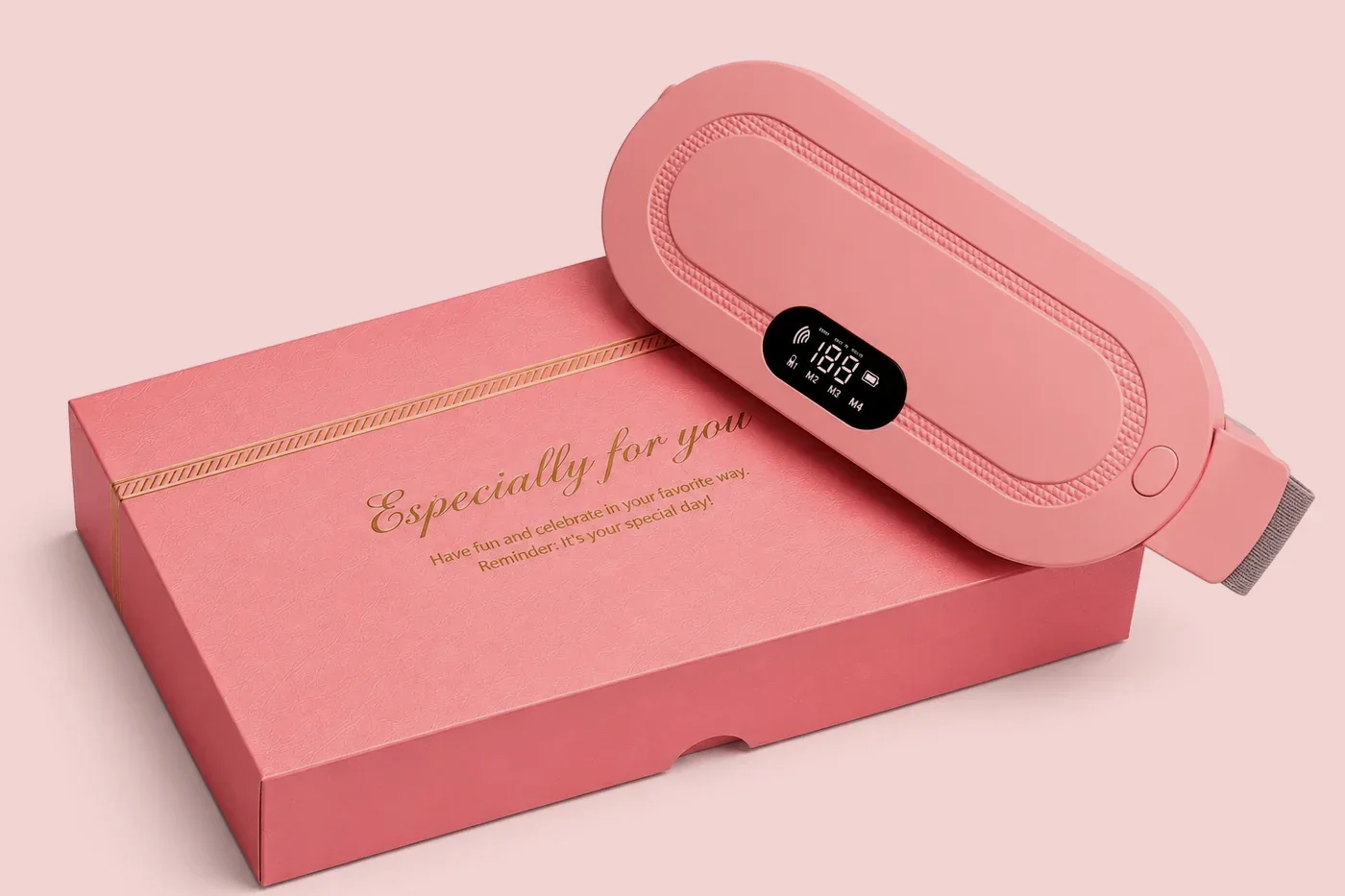 Pink period cramp heating massager belt on its pink gift box